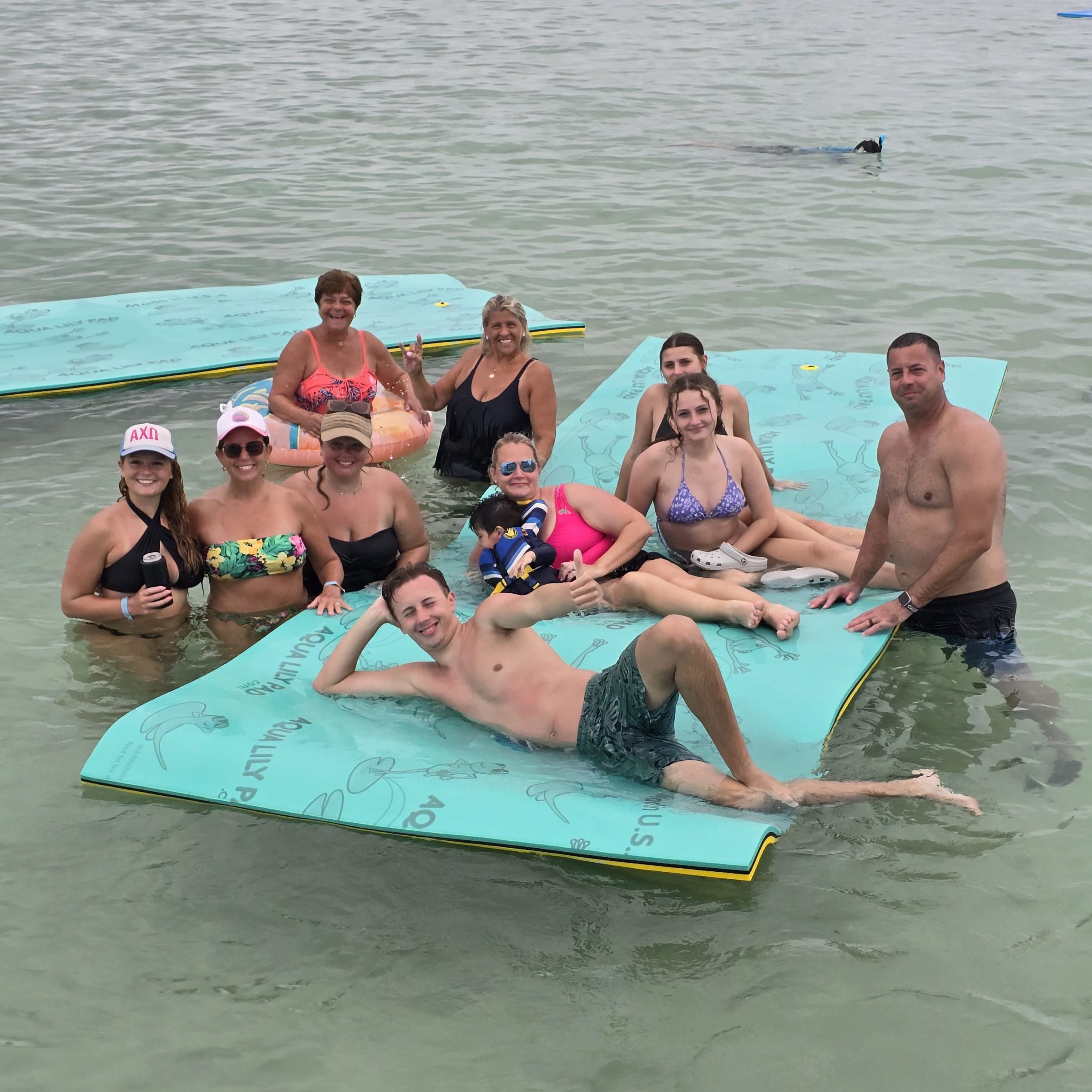 a group of people swimming in the water