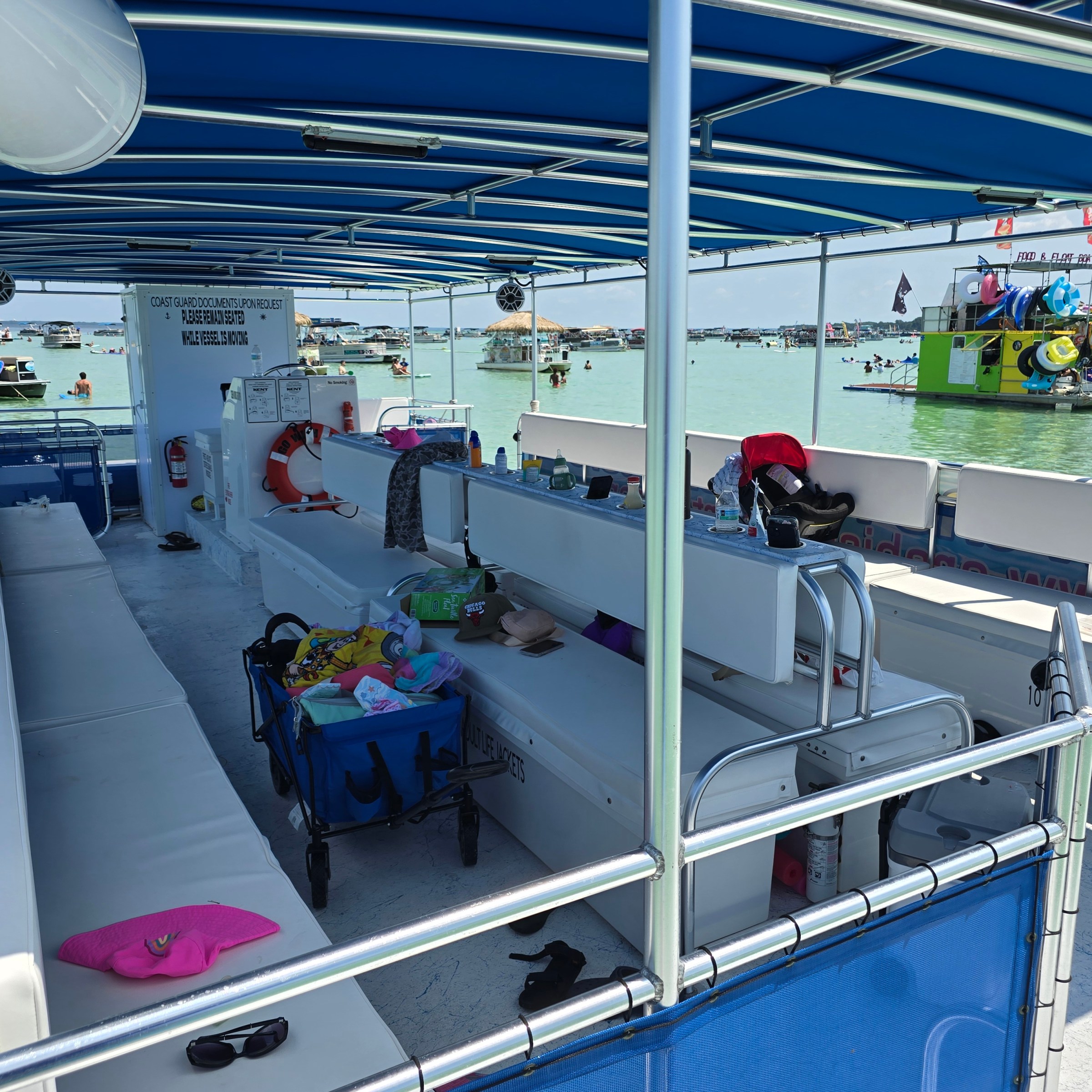 a group of people standing next to a fence