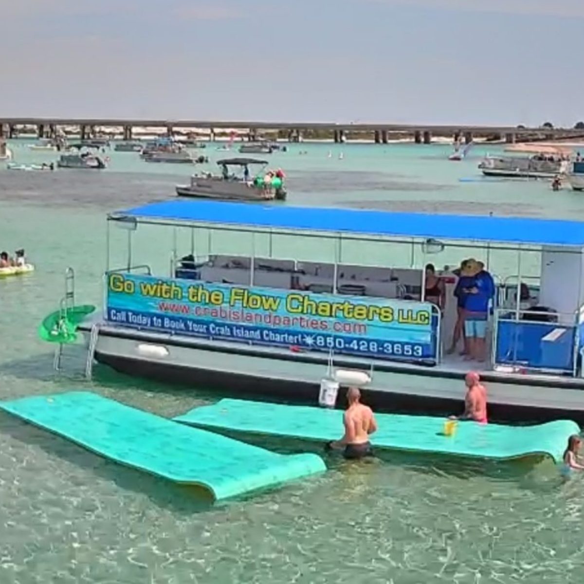 a group of people on a boat in the water